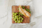 scalloped cheese board with spreader