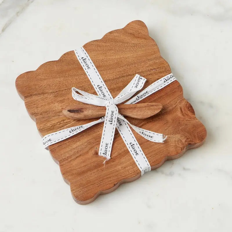 scalloped cheese board with spreader