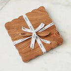 scalloped cheese board with spreader