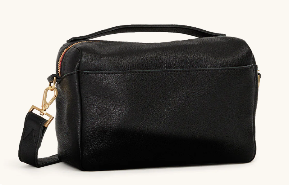 evan crossbody small in black with red zip