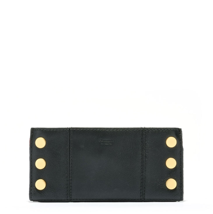 110 north in black + brushed gold with red zip