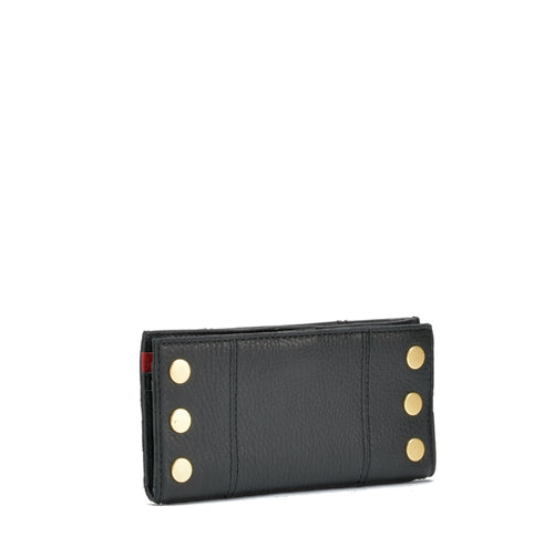 110 north in black + brushed gold with red zip