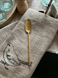 brass distressed spoon