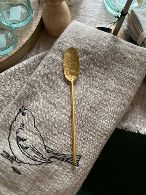 brass distressed spoon