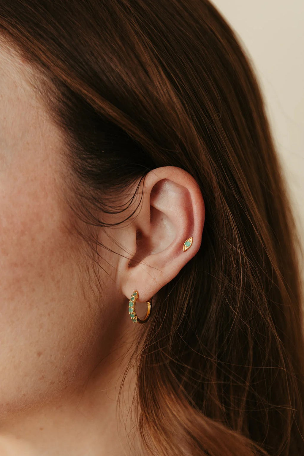 evil eye stud in emerald